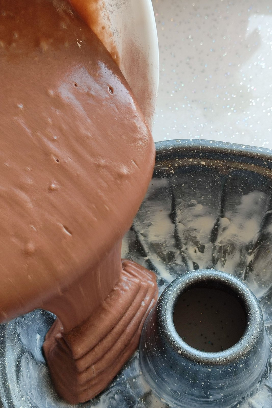 Why I grease the tin before the batter