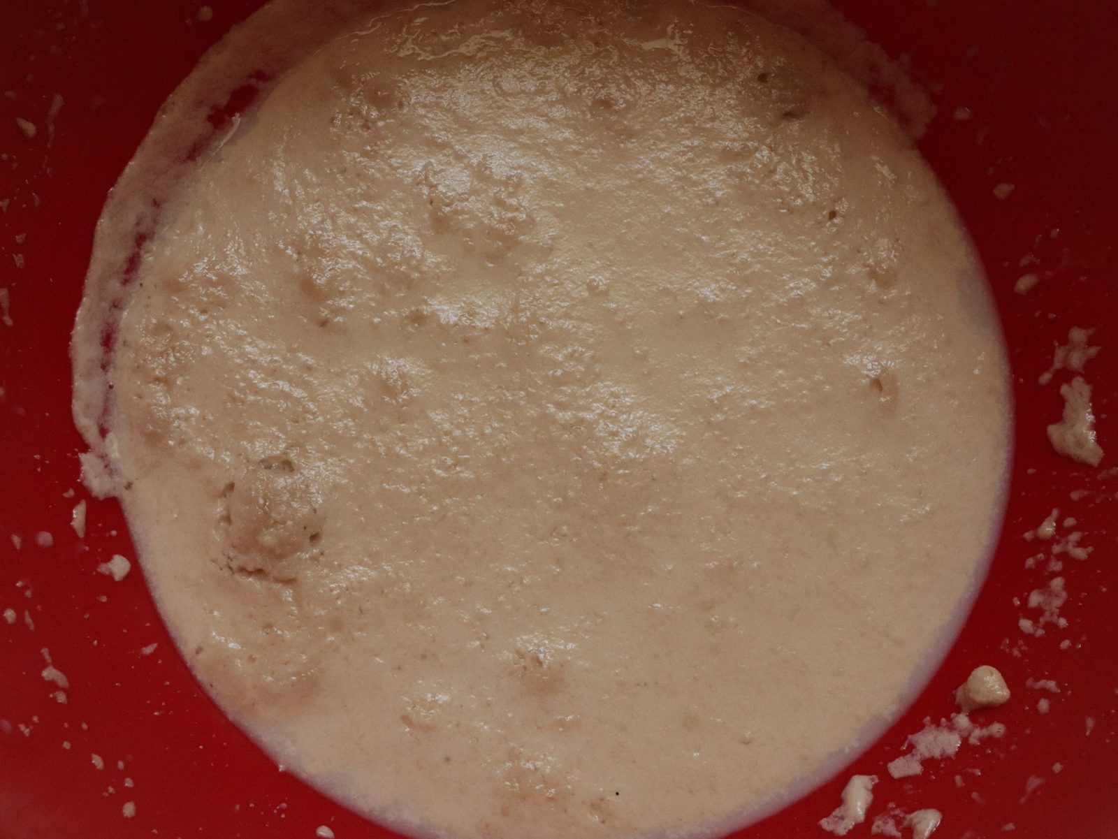 Step 2. Then add salt, vegetable oil and gradually add flour. Yeast dough